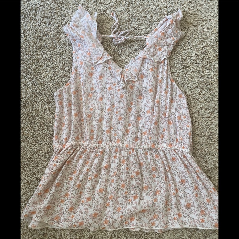Floral peplum sleeveless top
